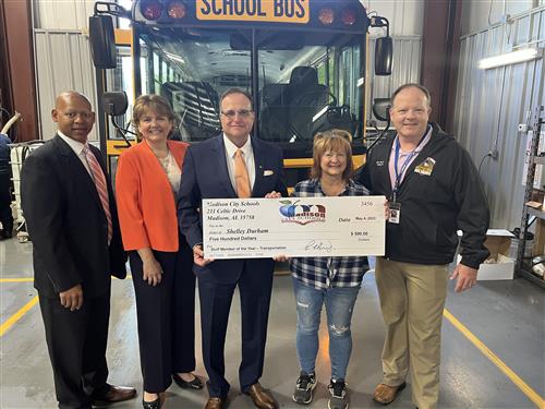 Shelley Durham bus driver with prize patrol and oversized check